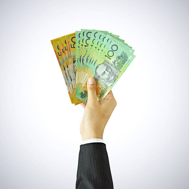 Hand showing money - AUD - Australian Dollars hand holding australian money