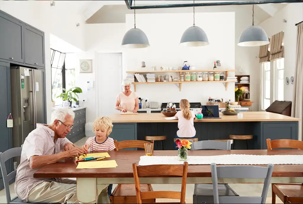 Grandparents with their grandchildren in the kitchen