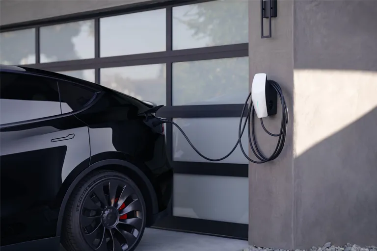 Tesla Wall connector mounted to a garage wall